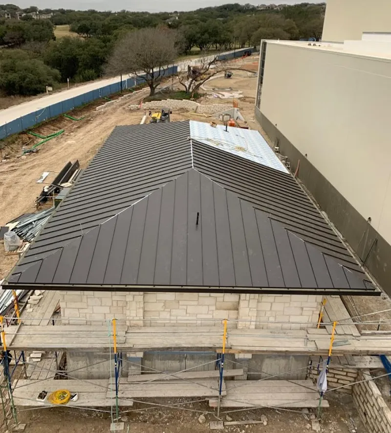 Metal roof new construction with scaffolding in Bay City